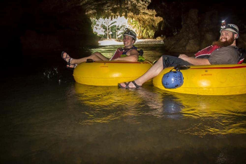 Guests cave tubing through Belize river caves on Private Cave Tubing Tour From Belize City