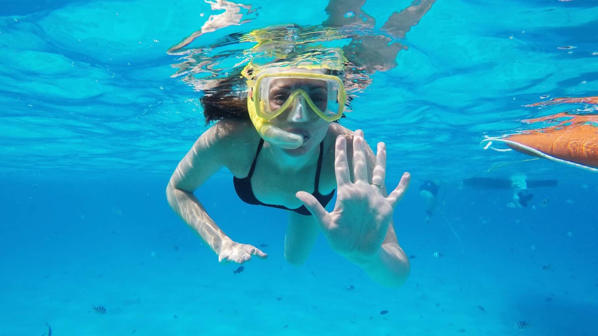 Guest snorkeling over the Belize Barrier Reef on Silk Cayes and Turtle Ray Alley