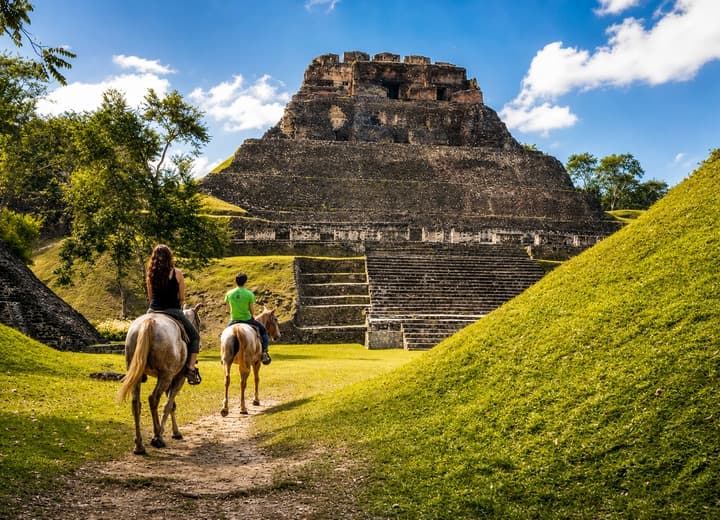 Guests horseback riding near Xunantunich Maya ruins on Xunantunich and Horseback Riding from Belize City
